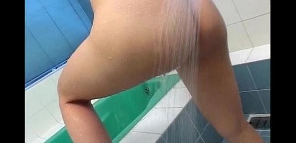  Asian brunette taking a shower and has nice boobs